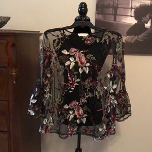 Sheer pull over top with floral design